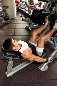 Low section of man exercising in gym