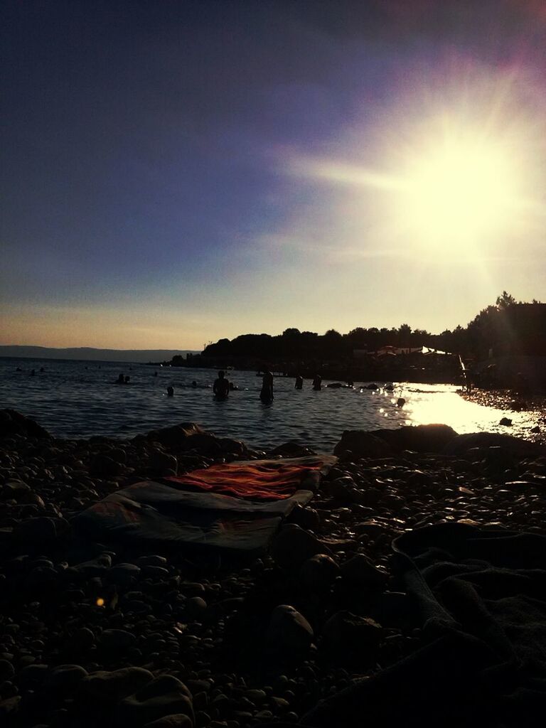 water, sea, beach, sun, shore, sunlight, sunbeam, horizon over water, scenics, sky, tranquil scene, tranquility, beauty in nature, lens flare, nature, sand, sunny, idyllic, nautical vessel, sunset