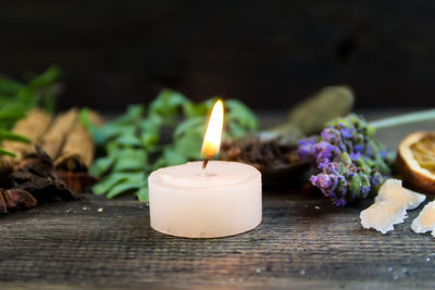 Close-up of tea light candles on table