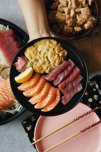 High angle view of person preparing food on table