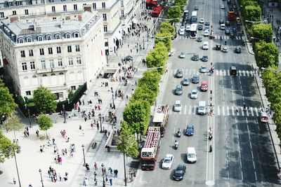 High angle view of people walking on street in city