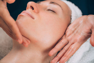 Close-up of woman getting massage therapy at spa