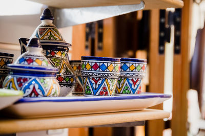 Traditional moroccan handmade crafts plates and cups in marrakech medina souvenir shop