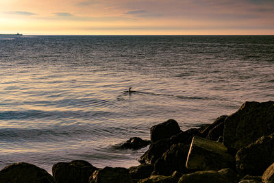 Scenic view of sea against sky during sunset