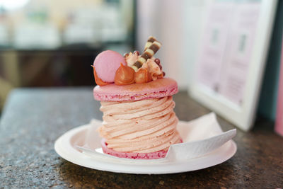Macaroon. delicious pink french dessert with tasty decorations. 
