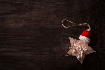 Close-up of christmas decoration on wood