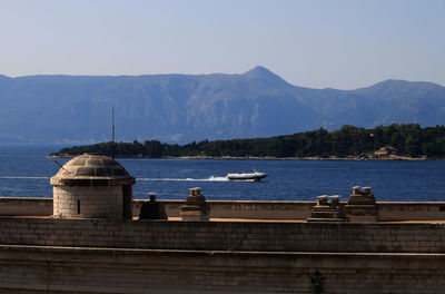 View of sea against mountain range