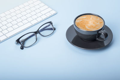 High angle view of coffee cup on table