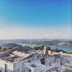 Scenic view of landscape against blue sky