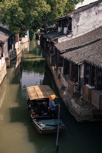 Chinese ancient town with river, boat and history buildings