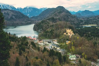 Scenic view of townscape by mountains