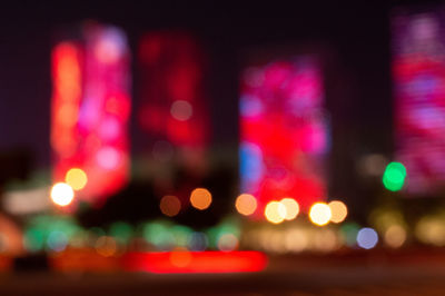 Defocused image of illuminated city at night