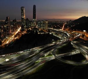 High angle view of illuminated city buildings at night