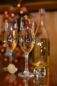 Close-up of wine glasses on table