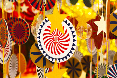 Close-up of decorations hanging in market stall
