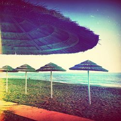 Scenic view of beach against blue sky