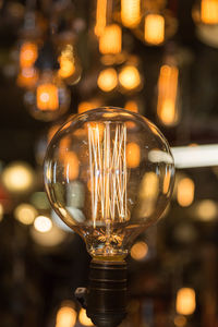 Close-up of illuminated light bulb