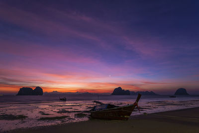 Scenic view of beach against sky during sunset