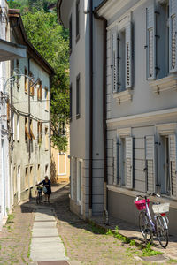 Bicycle on street amidst buildings