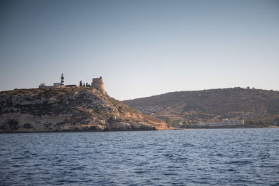 View of calamosca hill and its tower and lighthouse. cagliari, sardinia, italy