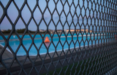 Full frame shot of chainlink fence in swimming pool