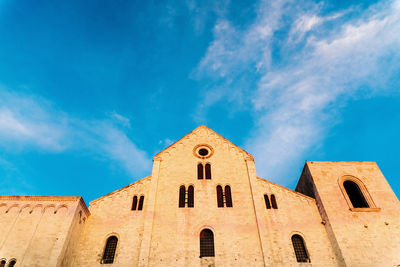 Low angle view of building against blue sky