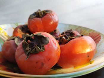 High angle view of fruits in plate on table