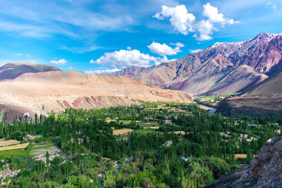 Scenic view of landscape and mountains against sky