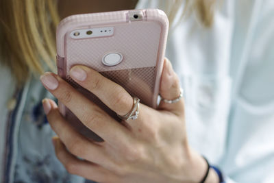 Close-up of woman using mobile phone