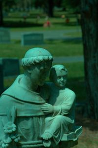 Close-up of sculpture at graveyard