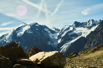 Scenic view of snowcapped mountains against sky