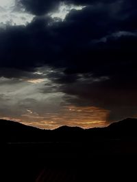 Scenic view of silhouette landscape against sky during sunset