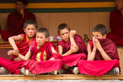 High angle view of people sitting on floor