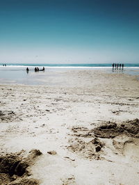 Scenic view of beach against clear sky