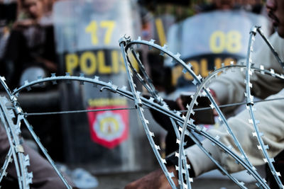 Close-up of chainlink fence against blurred background