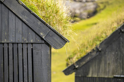 Barn on field by house