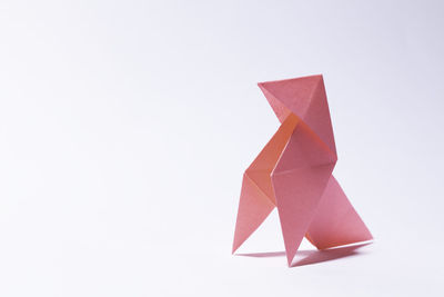 Close-up of paper flag against white background