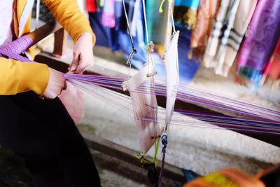 Midsection of worker working in textile industry