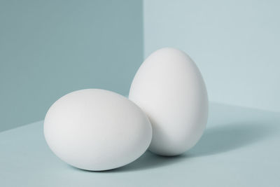 Close-up of white eggs on table