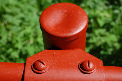 Close-up of red bell outdoors