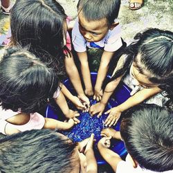 High angle view of people with hands