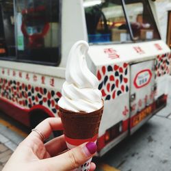 Midsection of person holding ice cream