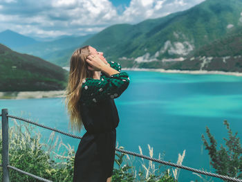 Woman standing in mountains