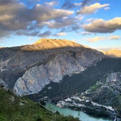 Scenic view of mountains against cloudy sky