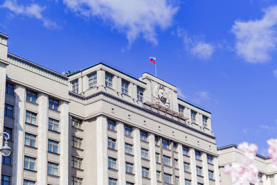 Low angle view of buildings against blue sky