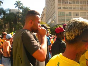 People looking at city street