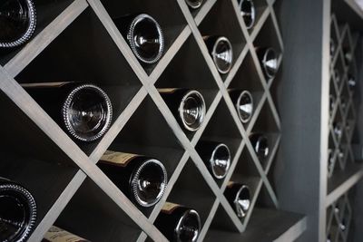 Close-up of wine bottles on shelf