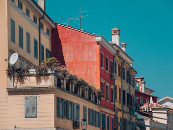 Low angle view of buildings against blue sky