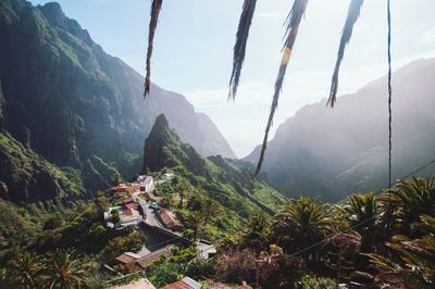Panoramic shot of building and mountains against sky