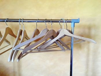 Empty clothes hanger hanging on metal pole